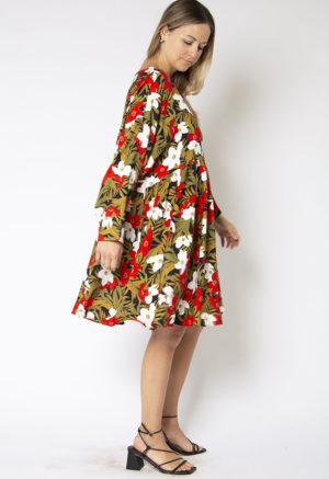 Side view of straight size model wearing Island Floral Short Oversized Dress.