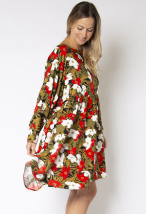 Side view of straight size model wearing Island Floral Short Oversized Dress.