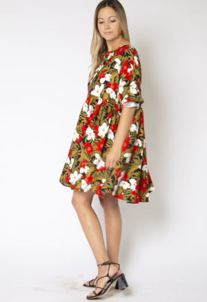 Side view of straight size model wearing Island Floral Short Oversized Dress.