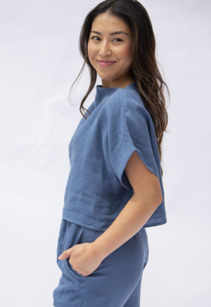 Side view of straight size model wearing Denim Linen Boatneck Cropped Top.