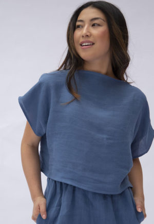 Front view of straight size model wearing Denim Linen Boatneck Cropped Top.