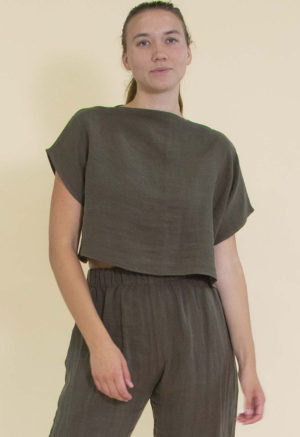 woman in dark green line boatneck short sleeve top and matching wide-leg pants