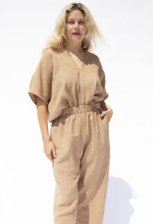 Front view of straight size model wearing Latte Linen Double V Top.