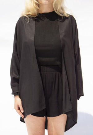 Front view of straight size model wearing Black Lyocell Easy Jacket.