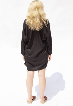 Back view of straight size model wearing Black Lyocell Easy Jacket.