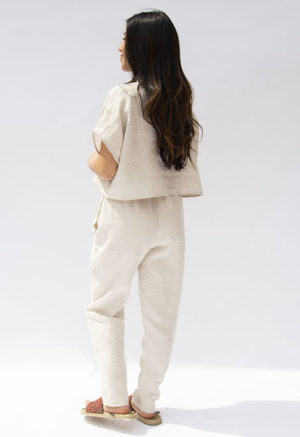 Back view of straight size model wearing Oatmeal Linen Easy Tapered Pant.