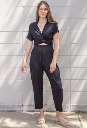 Front view of straight size model wearing Black Rib Everything Top.