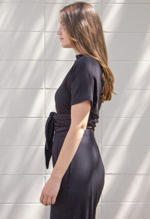 Side view of straight size model wearing Black Rib Everything Top.