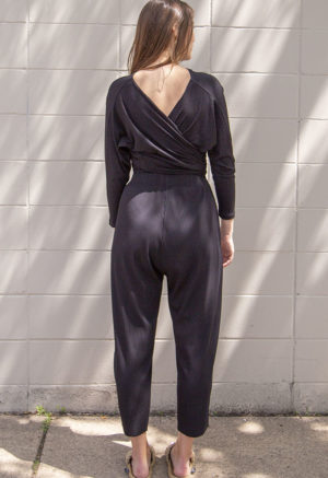 Back view of straight size model wearing Black Rib Everything Top.
