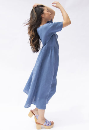 Side view of straight size model wearing Denim Linen Gathered Midi Dress.