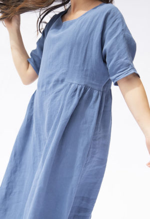 Front/side view of straight size model wearing Denim Linen Gathered Midi Dress.