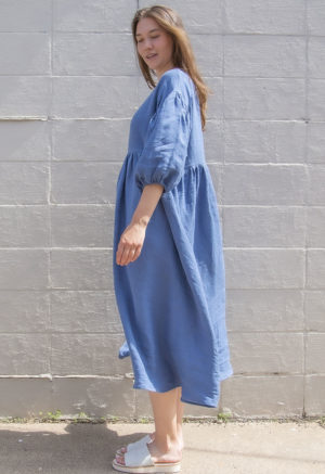 Side view of straight size model wearing Denim Linen Oversized Dress.