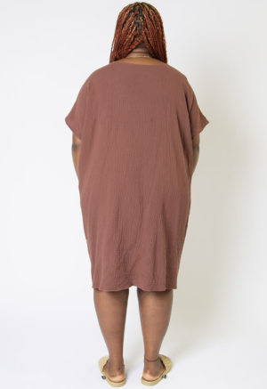 Back view of plus size model wearing Raisin Cotton Reversible Smock Dress.