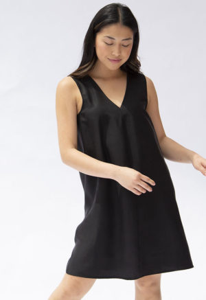 Front view of straight size model wearing Black Lyocell Shift Dress.