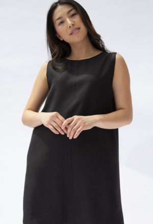Front view of straight size model wearing Black Lyocell Shift Dress.