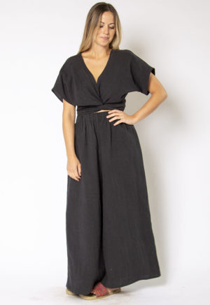 Front view of straight size model wearing Black Linen Short Sleeve Tie Top and Black Linen Extra Wide-Leg Pant.