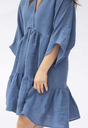 Front view of straight size model wearing Denim Linen Short Tiered Dress.