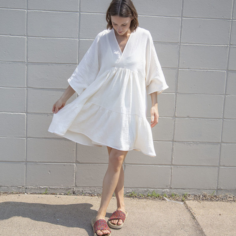 Front view of straight size model wearing Cream Gauze Short Tiered Dress.