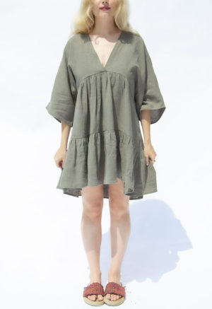 Front view of straight size model wearing Moss Linen Short Tiered Dress.