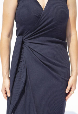 Front view of straight size model wearing Navy Rib Sleeveless Wrap Dress.
