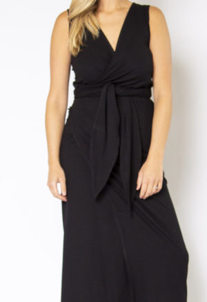 Close-up front view of straight size model wearing Black Rib Sleeveless Wrap Dress.