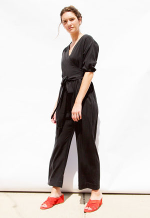 Front view of straight size model wearing Black Lyocell Short-Sleeve Reversible Jumper.
