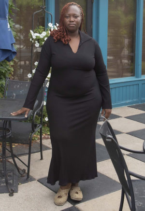 Front view of plus size model wearing Black Midi Swing Collar Rib Dress.