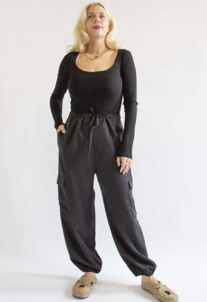 Front view of straight size model wearing Black Lyocell Cargo Pant.