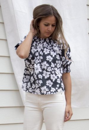 Front view of straight size model wearing Jungle Floral Short Sleeve Peasant Blouse.
