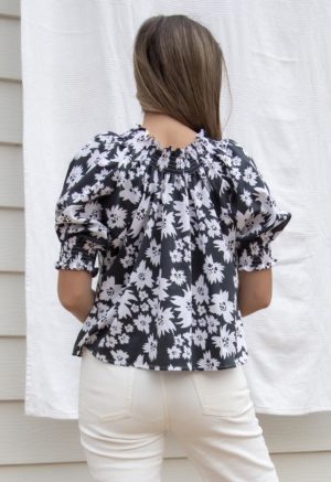 Back view of straight size model wearing Jungle Floral Short Sleeve Peasant Blouse.