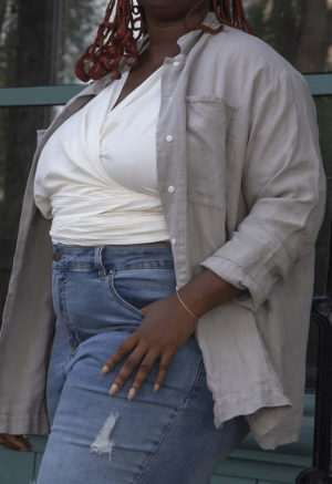 Front/side view of plus size model wearing Pebble Gray Work Jacket.
