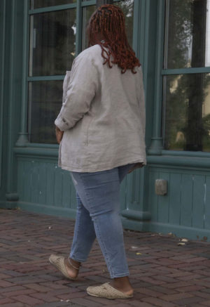 Back/side view of plus size model wearing Pebble Gray Work Jacket.