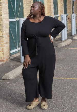 Front view of plus size model wearing Black Rib Long Sleeve Reversible Jumper.