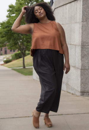 Front view of plus size model wearing Copper Lyocell Reversible Scoop Tank.