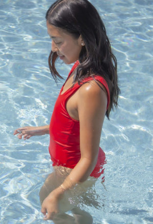 Side view of straight size model wearing Valentine Red Square Neck One Piece.