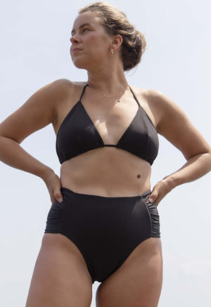 Front view of straight size model wearing Black Ruched High-Waisted Bottoms.