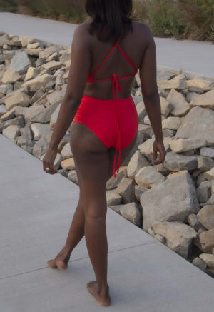 Back view of straight size model wearing Valentine Ruched Bikini Bottoms.