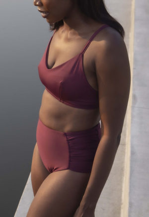 Front/side view of straight size model wearing Fig Ruched High-Waisted Bottoms.