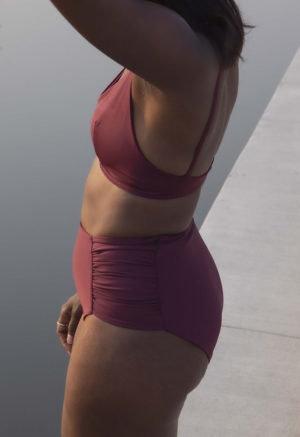 Side view of straight size model wearing Fig Ruched High-Waisted Bottoms.
