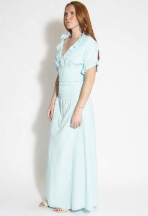 Front/side view of straight size model wearing Capri Blue Smocked-Waist Maxi Skirt.