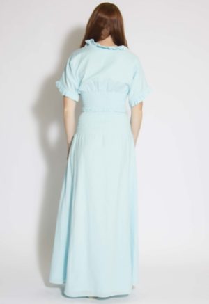 Back view of straight size model wearing Capri Blue Smocked-Waist Maxi Skirt.