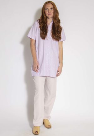 Front view of straight size model wearing Lavender Stripe Button-Up Short Sleeve Tunic.
