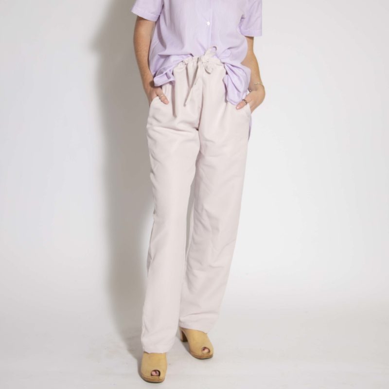 Front view of straight size model wearing Pale Pink Drawstring Pant.