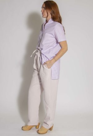 Side view of straight size model wearing Pale Pink Drawstring Pant.