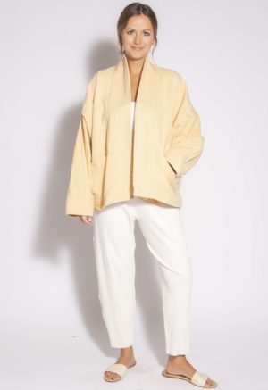 Front view of straight size model wearing Pale Yellow Short Oversized Jacket.