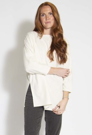 Front view of straight size model wearing Cream Silk Tunic Pullover.