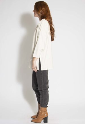 Side view of straight size model wearing Cream Silk Tunic Pullover.