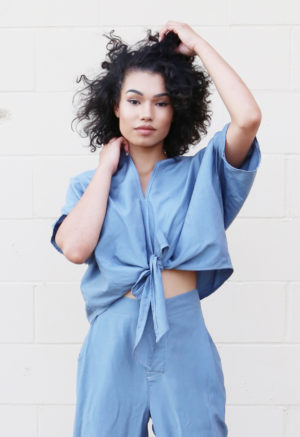Front view of straight size model wearing Blue Steel Bow Cropped Top.