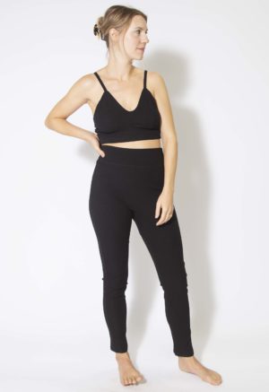 Front view of straight size model wearing Black Rib Leggings.