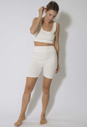Front view of straight size model wearing Ivory Rib Reversible Scoop Bralette and Biker Shorts.